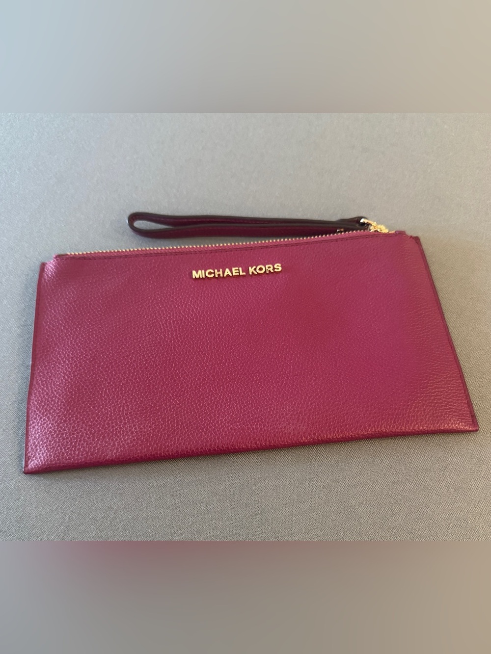 Michael Kors Pebbled Leather Wristlet in Berry Plum